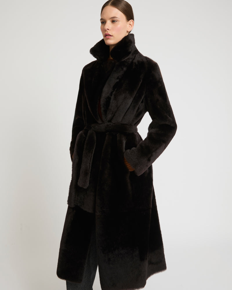 Long reversible belted shearling coat