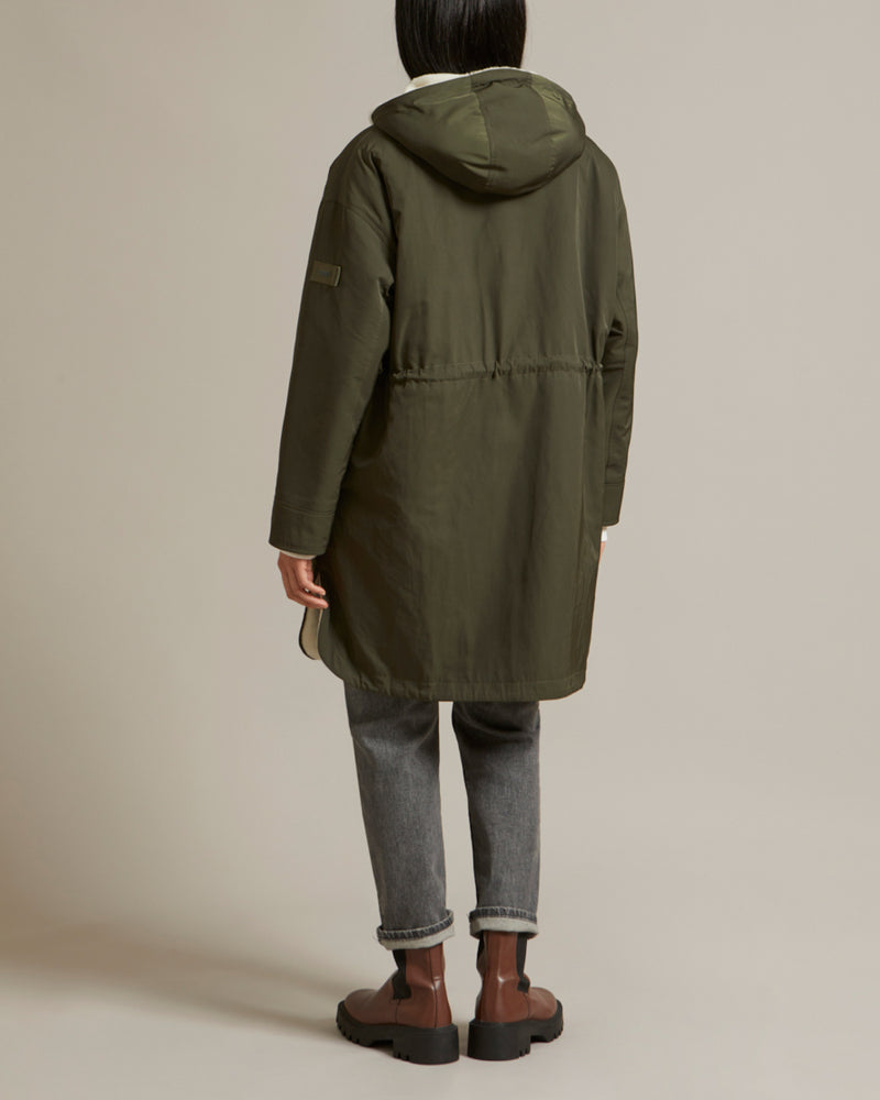 Reversible parka in water-repellent technical fabric and shearling