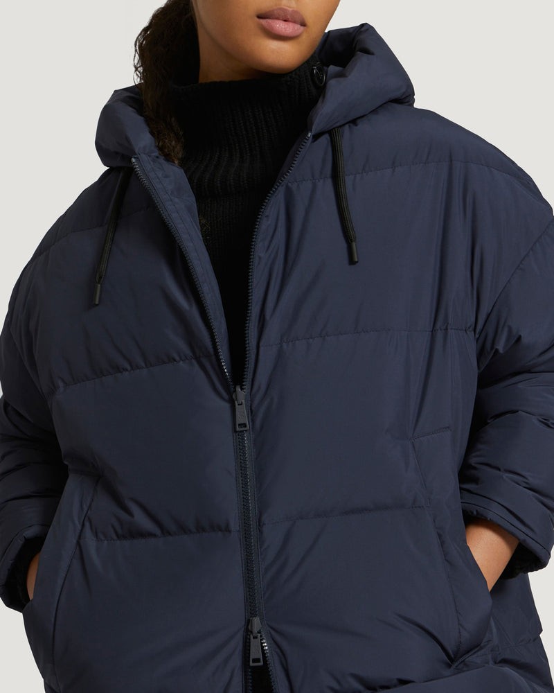 Long reversible hooded down jacket in waterproof technical fabric