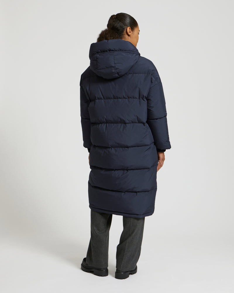 Long reversible hooded down jacket in waterproof technical fabric