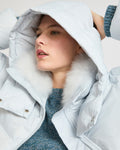 A line down jacket in water-repellent technical fabric with fluffy lambswool collar