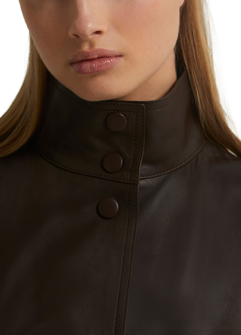 Long belted leather trench coat with detachable sleeves